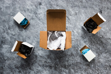 online delivery parcel boxes on grey background, competitions and customer choices