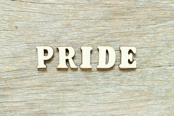 Alphabet letter in word pride on wood background