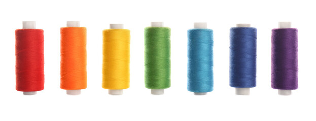 Set of colorful sewing threads on white background