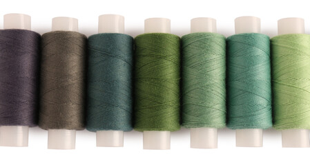 Set of colorful sewing threads on white background, top view