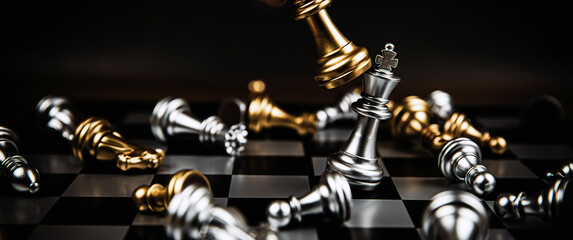 Close up king chess challenge or battle fighting with falling chess on chess board concepts of leadership and strategy or strategic plan and human resource or risk management or team player.