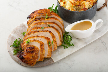 Roasted turkey breast sliced on a plate for holidays