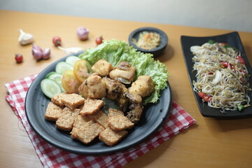 chicken and tempeh with onion sauce and bean sprouts