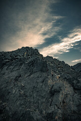 Colored rock on a background of morning sky and moon