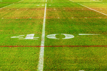 40 yard line on a grass of an American football field