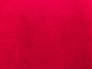 Red velvet fabric texture used as background. Empty red fabric background of soft and smooth textile material. There is space for text..