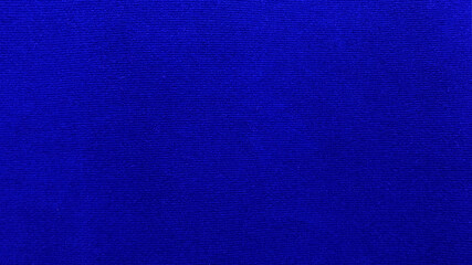 Blue velvet fabric texture used as background. Empty blue fabric background of soft and smooth...