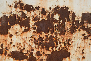 Paint stains are peeling off from the rust of steel plates.