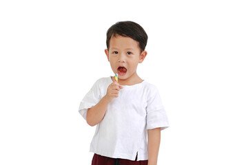 Asian little boy eating lollipop candy isolated on white background. Image with clipping path