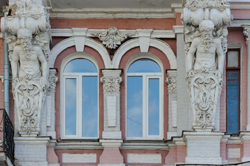 Ornate decoration of facade of an old building with sculptures in Kyiv Ukraine