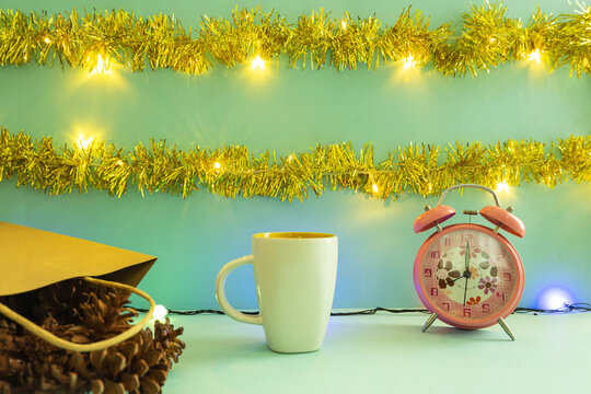 Minimalist Concept Idea Displaying Products. Coffee Mug On Christmas And New Year Background. Alarm Clock. Pine Flower