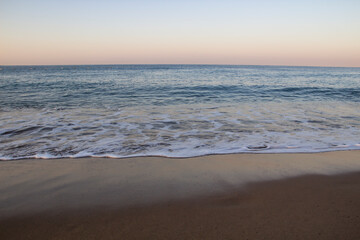 Fototapeta na wymiar Beautiful seascape with sea waves and sand. Sea waves on the beach.