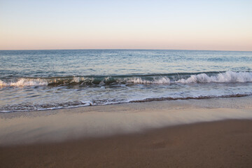 Beautiful seascape with sea waves and sand. Sea waves on the beach.