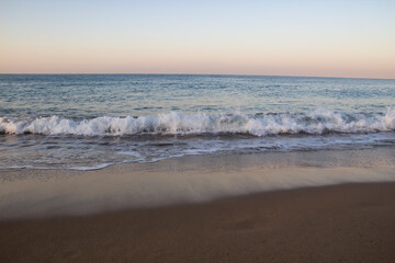 Beautiful seascape with sea waves and sand. Sea waves on the beach.