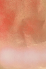 red  and white spray paint on gold colored paper