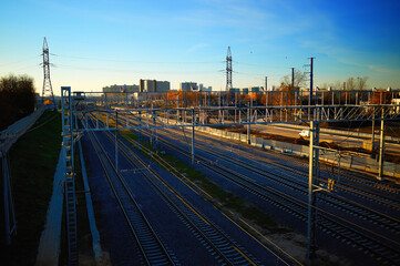 Fototapeta na wymiar Railway track during dramatic sunset background