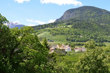 The beautiful village Prissian in Southtyrol mountains behind 
