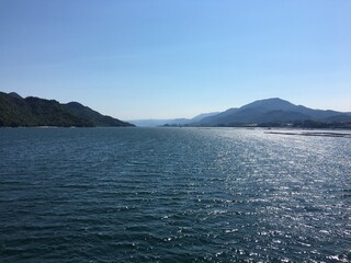 Scenic mountain range view above water in Japan