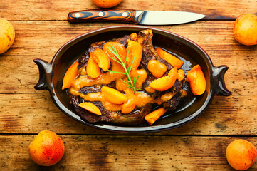 Veal steak fried with apricots