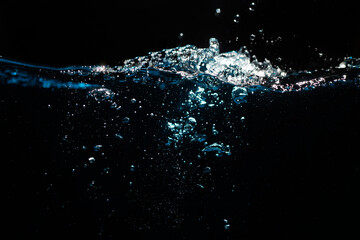 Water Surface with Ripple and Bubbles on Black Background. Water Wave	