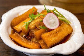 An appetizing cold dish, pickled radish in sauce