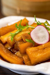 An appetizing cold dish, pickled radish in sauce