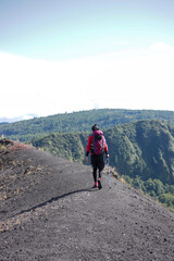 Fototapeta premium photo of a climber walking on a hill