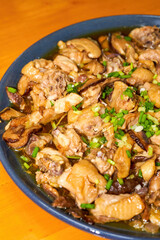 A delicious steamed chicken with shiitake mushrooms