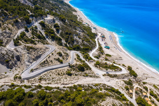 Serpentine road to Gialos Beach, Ionian Islands, Lefkada, Greece, aerial view