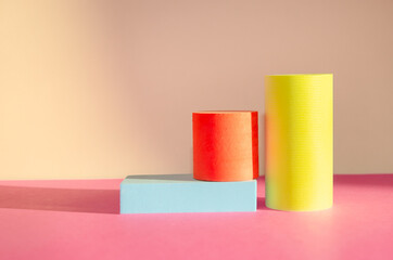 Bright minimalistic abstract background with three-dimensional geometric shapes: cylinders,...
