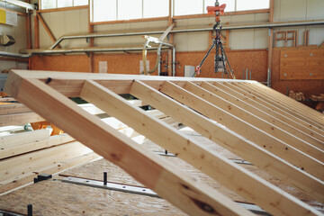 Large timber framework for a prefabricated wall in a factory