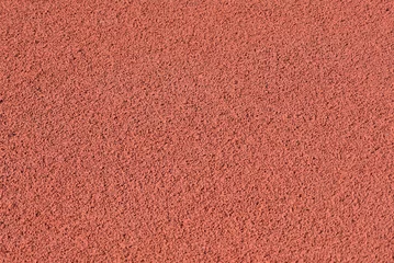 Foto auf Acrylglas Texture of a rubber crumb for stadium. Rubber asphalt. Resilient coating for sports and athletics fields, jogging, running track and cycling paths © Konstantin