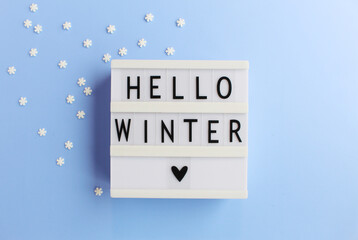Hello winter inscription. Creative background. Copy space. Flat lay concept.