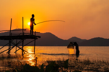 The beautiful sun shines on the water, while the two children go fishing and catch underwater animals.