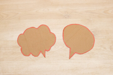 speech bubble on wooden background