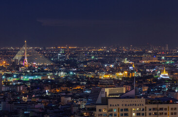 Aerial view Day to Night Time lapse of Chao Phraya River with Royal Grand Palace and Emerald Buddha Temple Landmark of Bangkok, Thailand.