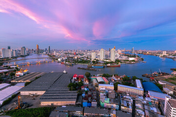 Fototapeta na wymiar Aerial view of Bangkok City skyline by Chao Phraya River in Thailand 