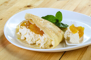 Pancake with cottage cheese and jam