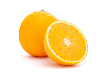 Close-up of Organic Indian Citrus fruit sweet  Seedless kinnow (Kinnow mandarin) high yield mandarin hybrid with its half cut, it is yellow in color, isolated over white background,
