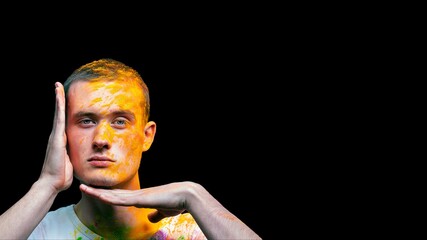  portrait of a person with painted face against black background 