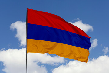 Armenia flag isolated on the blue sky background. close up waving flag of Armenia. flag symbols of Armenia. Concept of Armenia.