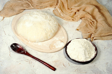White wheat cooking flour close up in spoon, dough homemade cooking baking background