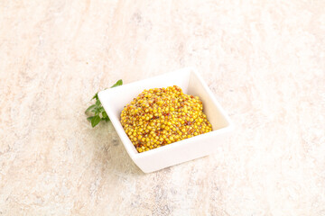 Grain mustard sauce in the bowl