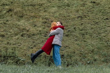 Fototapeta na wymiar lovers meeting, man and woman hugging outdoors