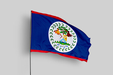 Belize flag isolated on the blue sky background. close up waving flag of Belize. flag symbols of Belize. Concept of Belize.