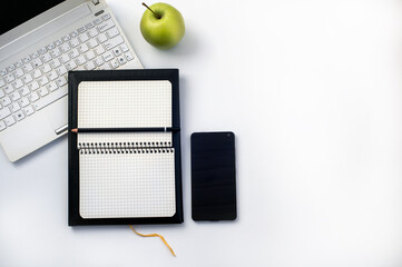 White desk office with laptop, smartphone and other work supplies with cup of coffee. Top view with...