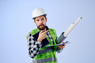 engineer with documents and drawings blueprints blue background