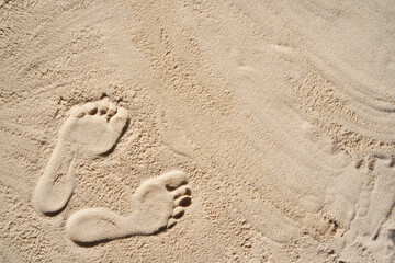 Footprint in the sand. Top view. Copy space for text