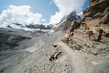 view on the alpine hiking trail to the “Hörnlihütte” hoernli cottage, near zermatt in...