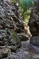 A narrow passage between the rocks of the Imbros Gorge on the island of Crete